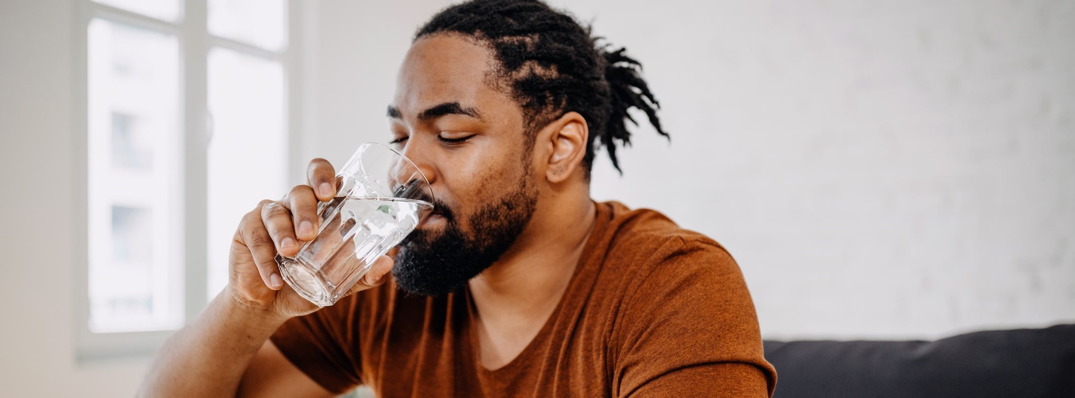 Thirsty man drinking water