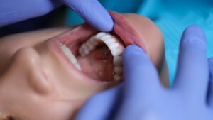 Dentist examining patient's oral health.